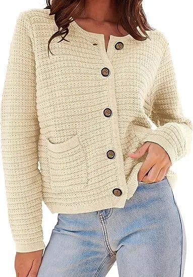 Woman wearing a cream cashmere cardigan with tailored trousers in a classic old money capsule wardrobe outfit.
