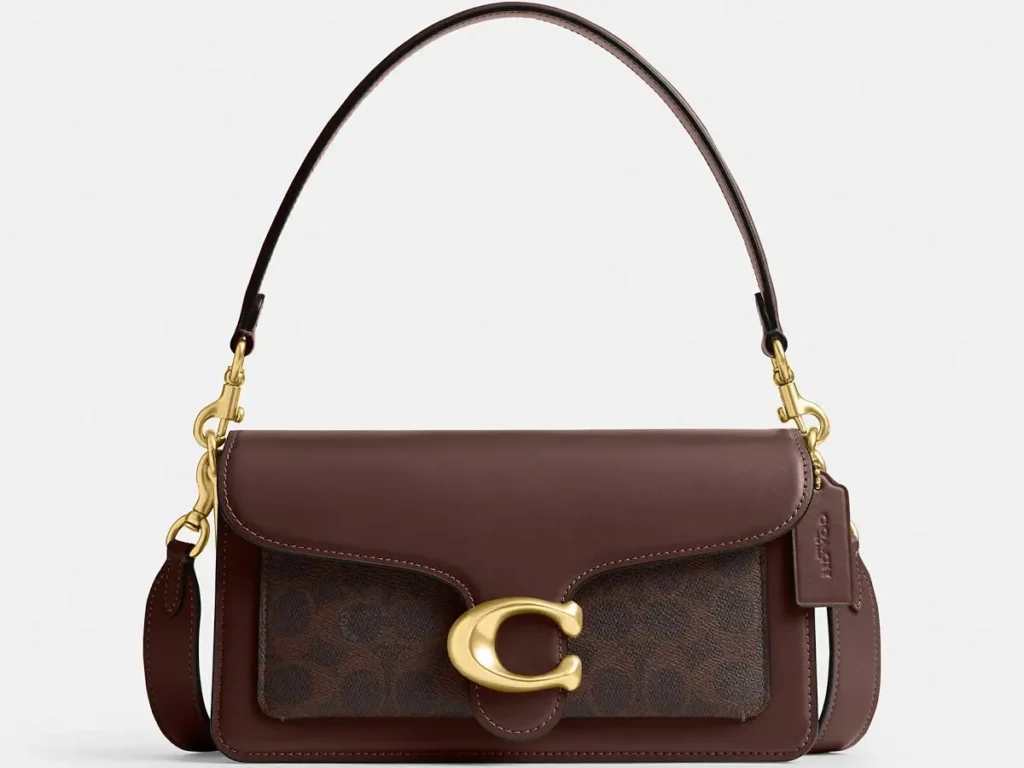 Brown structured crossbody bag with gold hardware and top handle