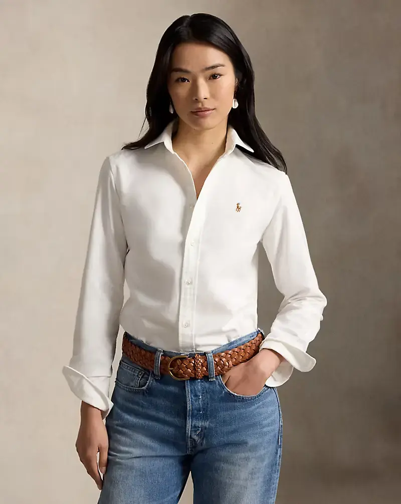 Classic white Oxford shirt styled with blue jeans for a timeless quiet luxury look