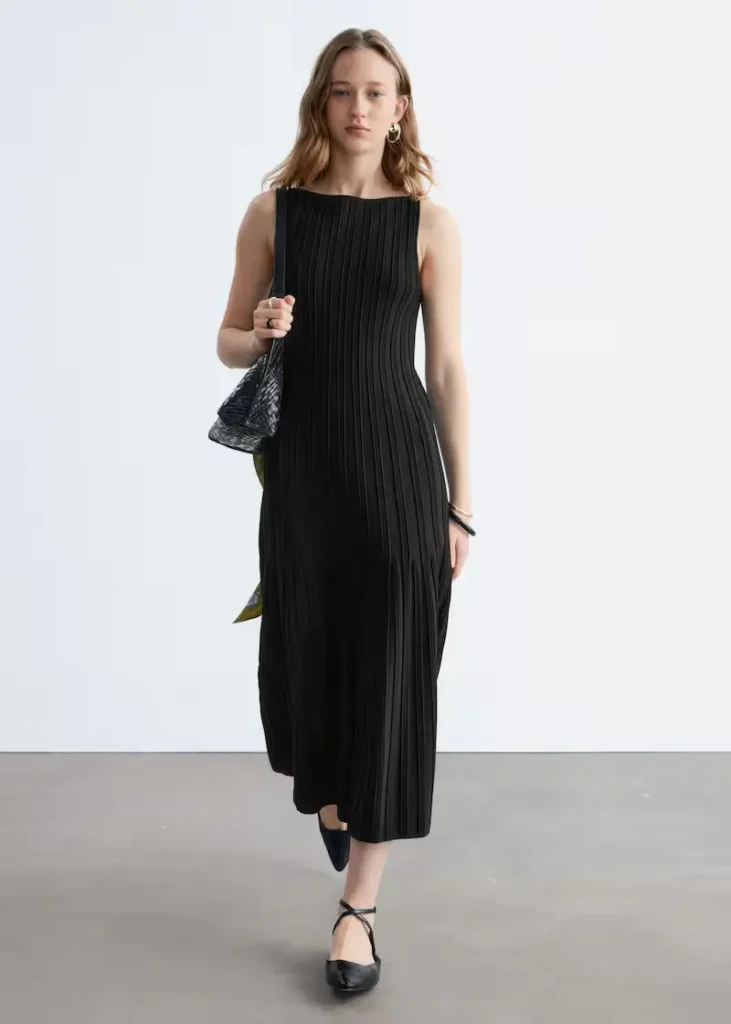 Minimalist Scandinavian-style dress featuring a versatile silhouette suitable for everyday capsule wardrobe outfits.